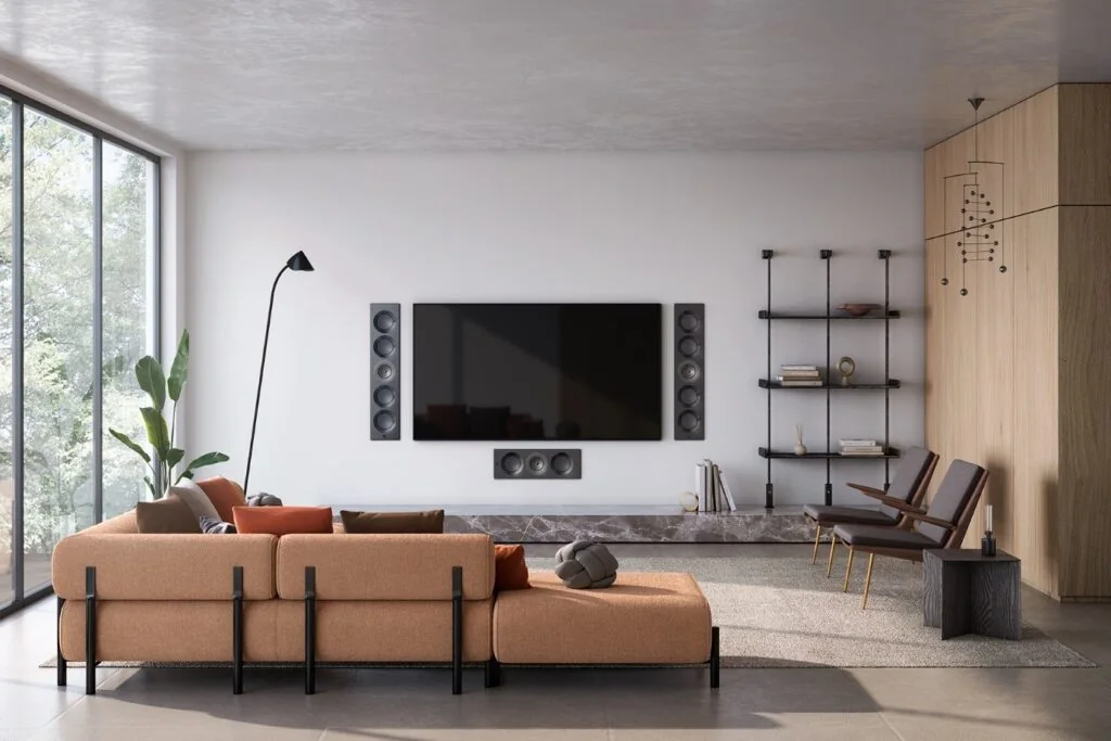 Living room with a television and KEF architectural speakers