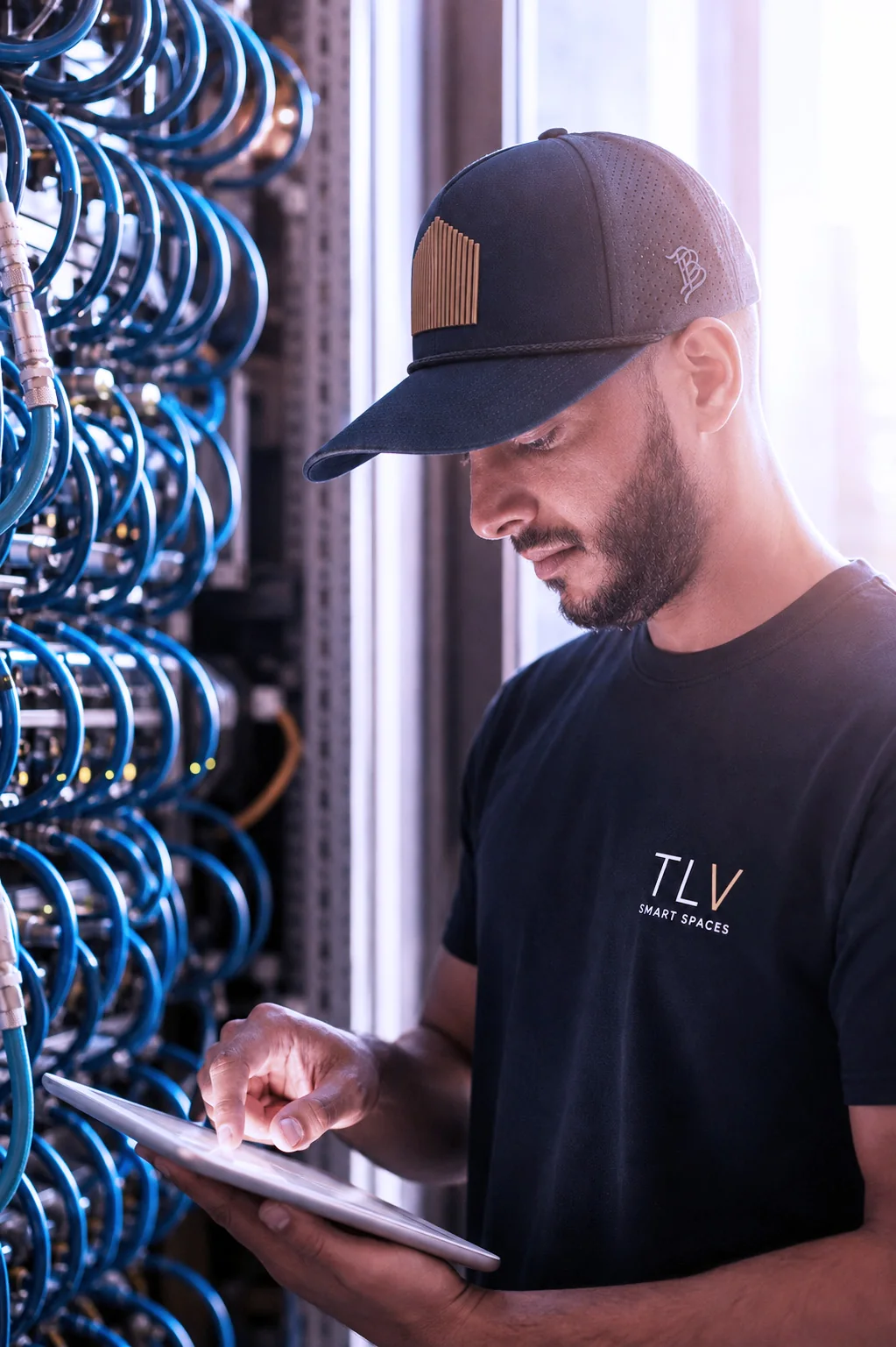 TLV Smart Spaces team member commissioning network equipment