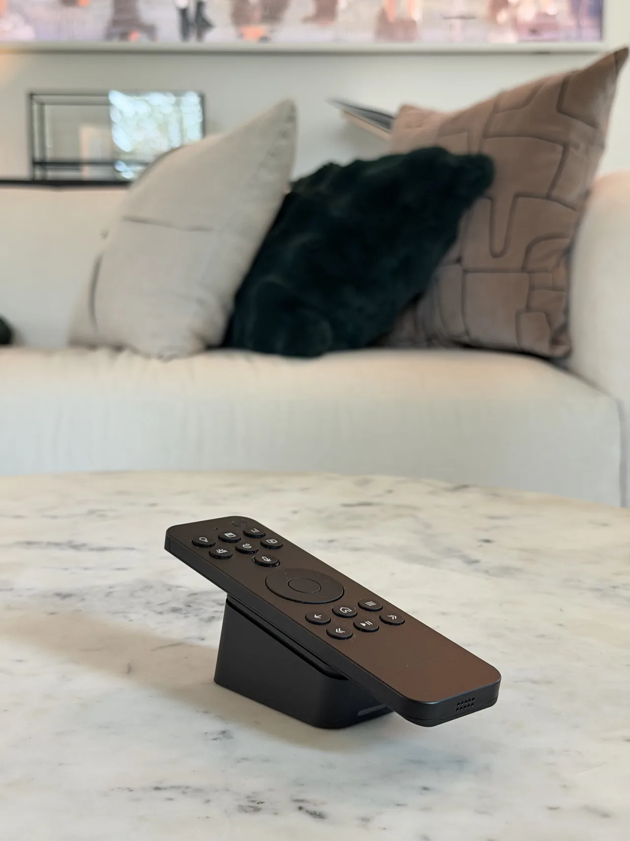 Josh.ai remote on a living room table