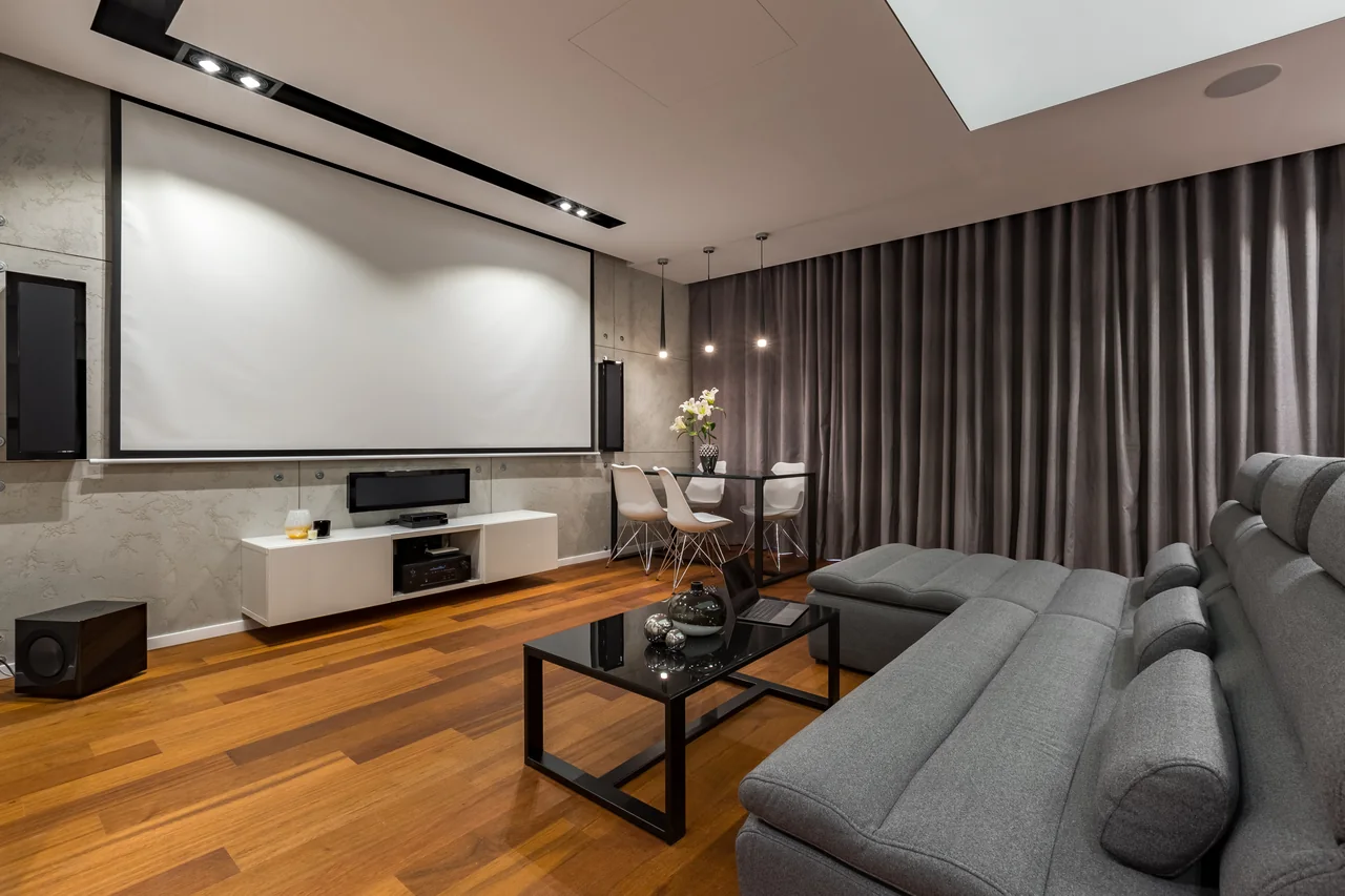 Dedicated home theater with projection screen and surround sound